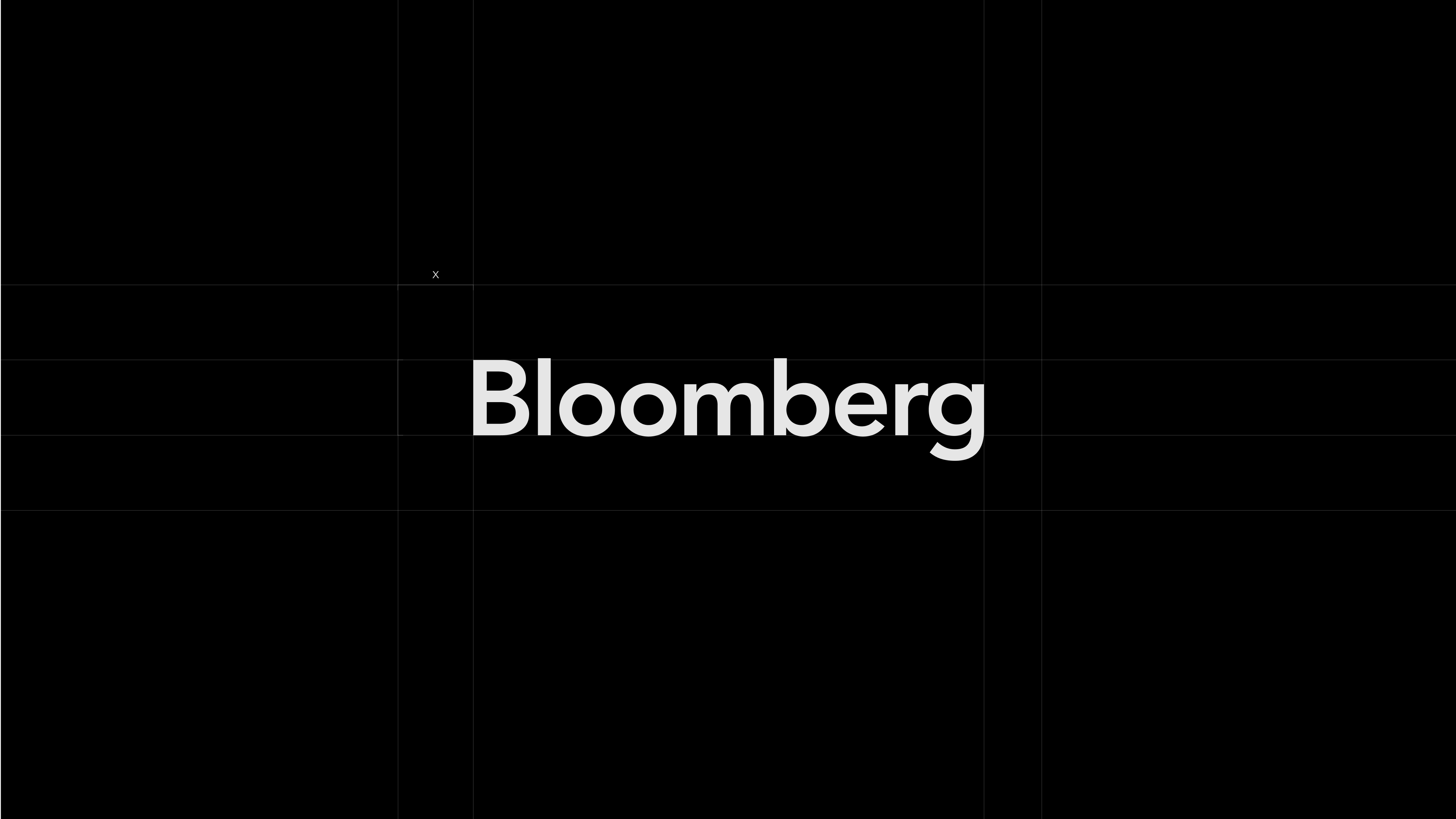 The Bloomberg wordmark centered on a black background with subtle construction lines.