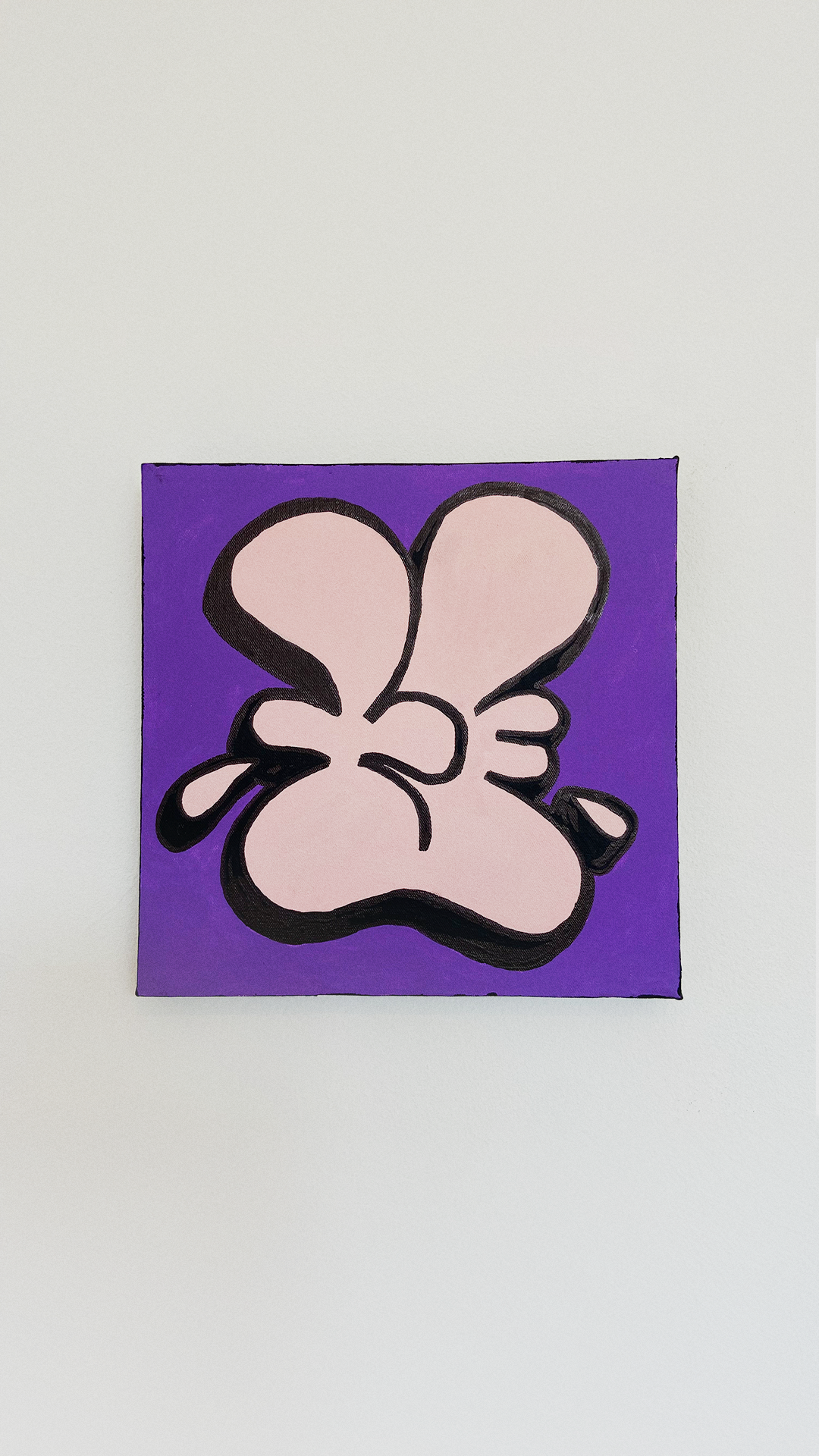 A pale pink Nice Studio hand symbol with bold black outlines on a purple acrylic-painted canvas.