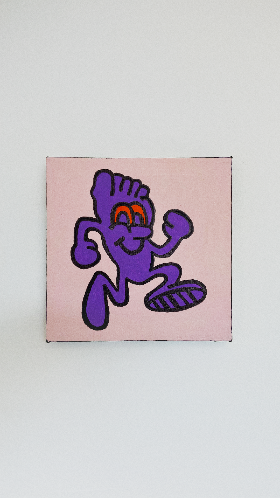 A smiling purple foot character with arms and shoes in a running pose on a pale pink canvas.