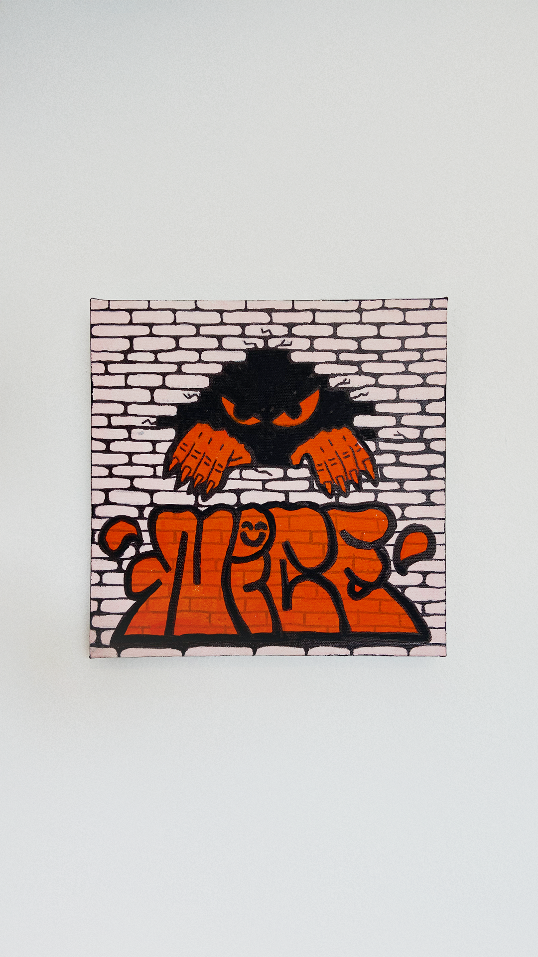 A shadowy figure with orange eyes and hands emerging from a brick wall above orange Nice lettering.