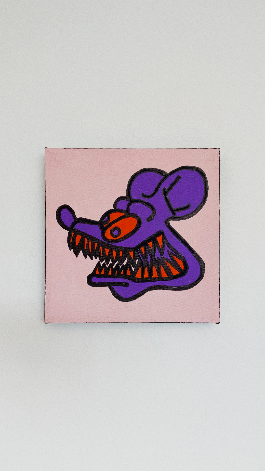 A purple long-snouted creature with exaggerated orange and white teeth on a pale pink background.