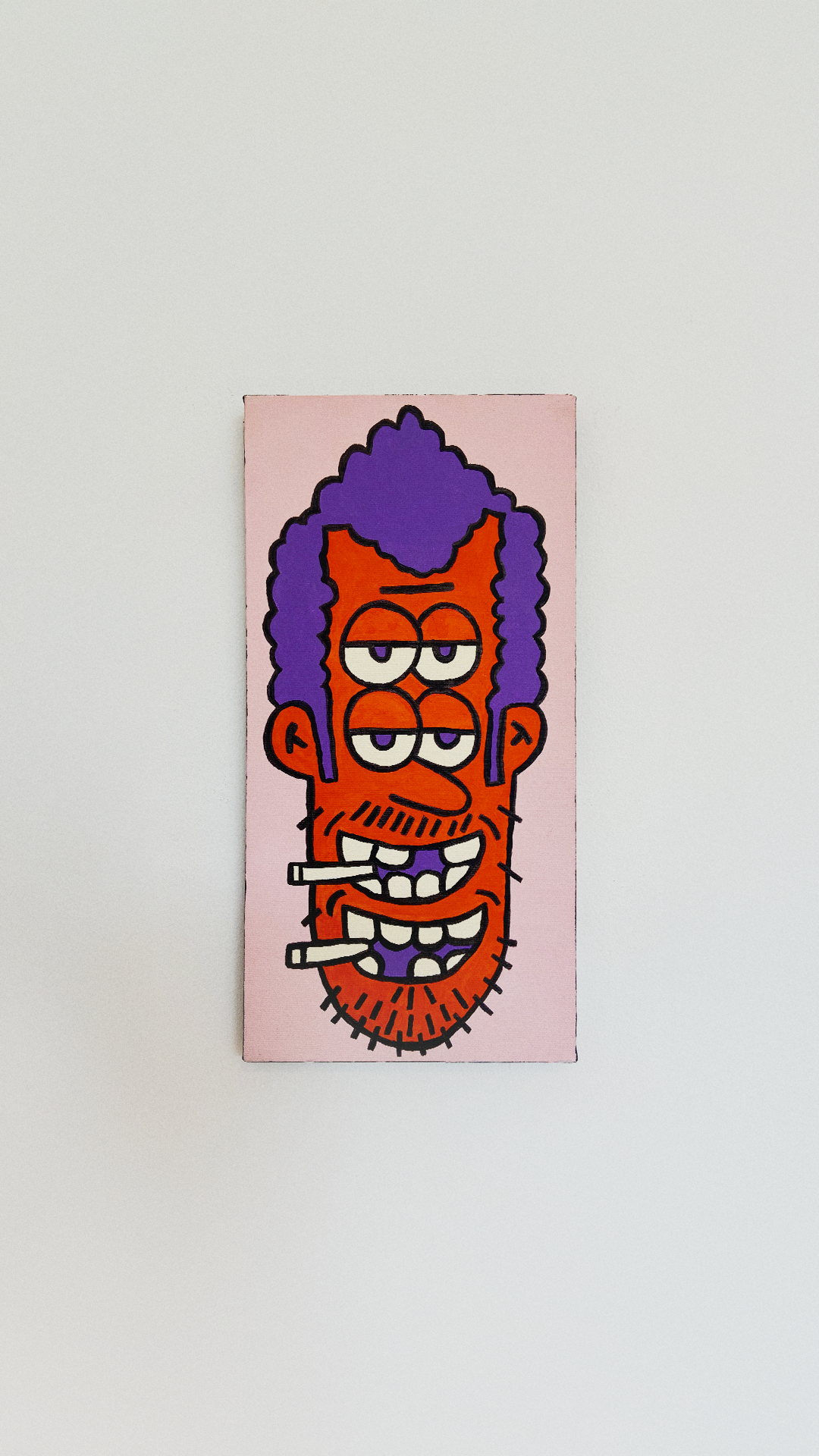 A tall orange face with purple hair, four eyes, and two smiling mouths with cigarettes on a narrow pink canvas.