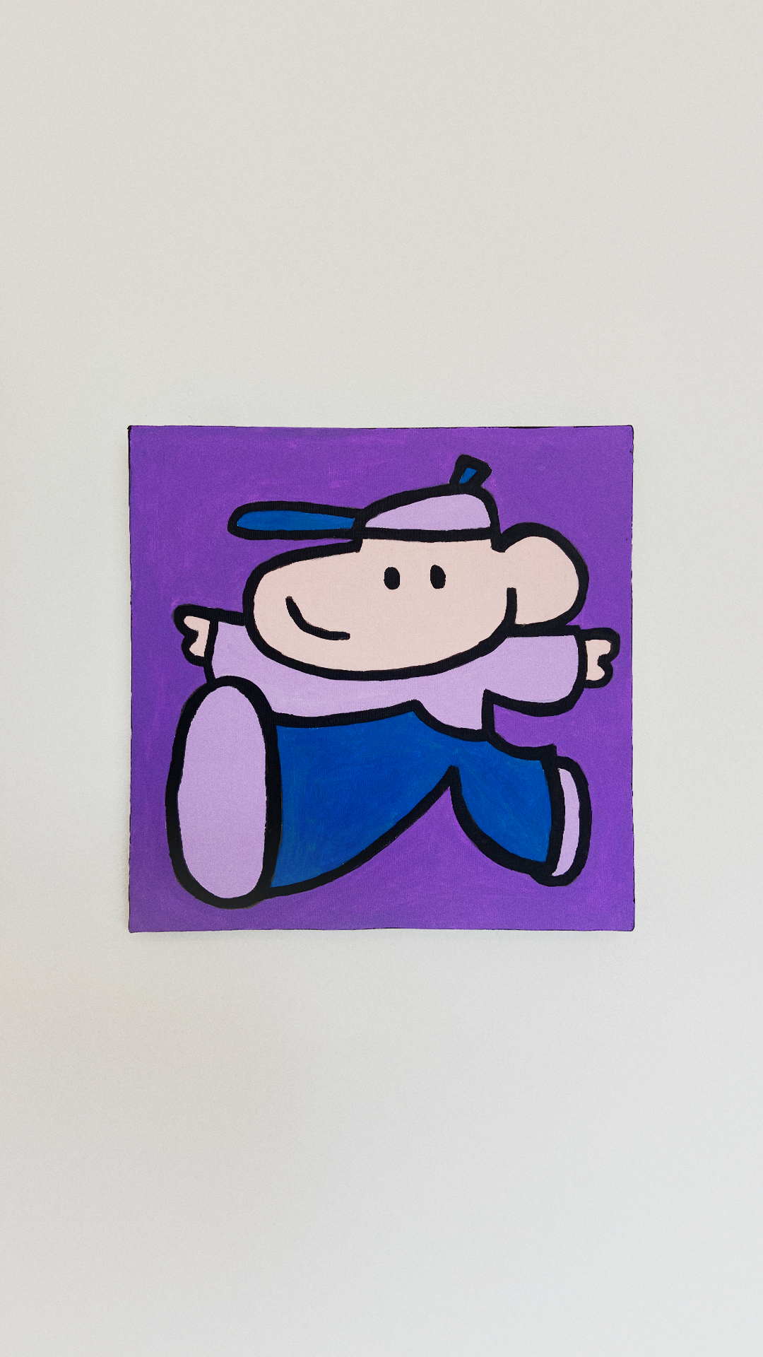 A playful pale pink character in a cap, purple shirt, and blue trousers, leaping against a purple background.