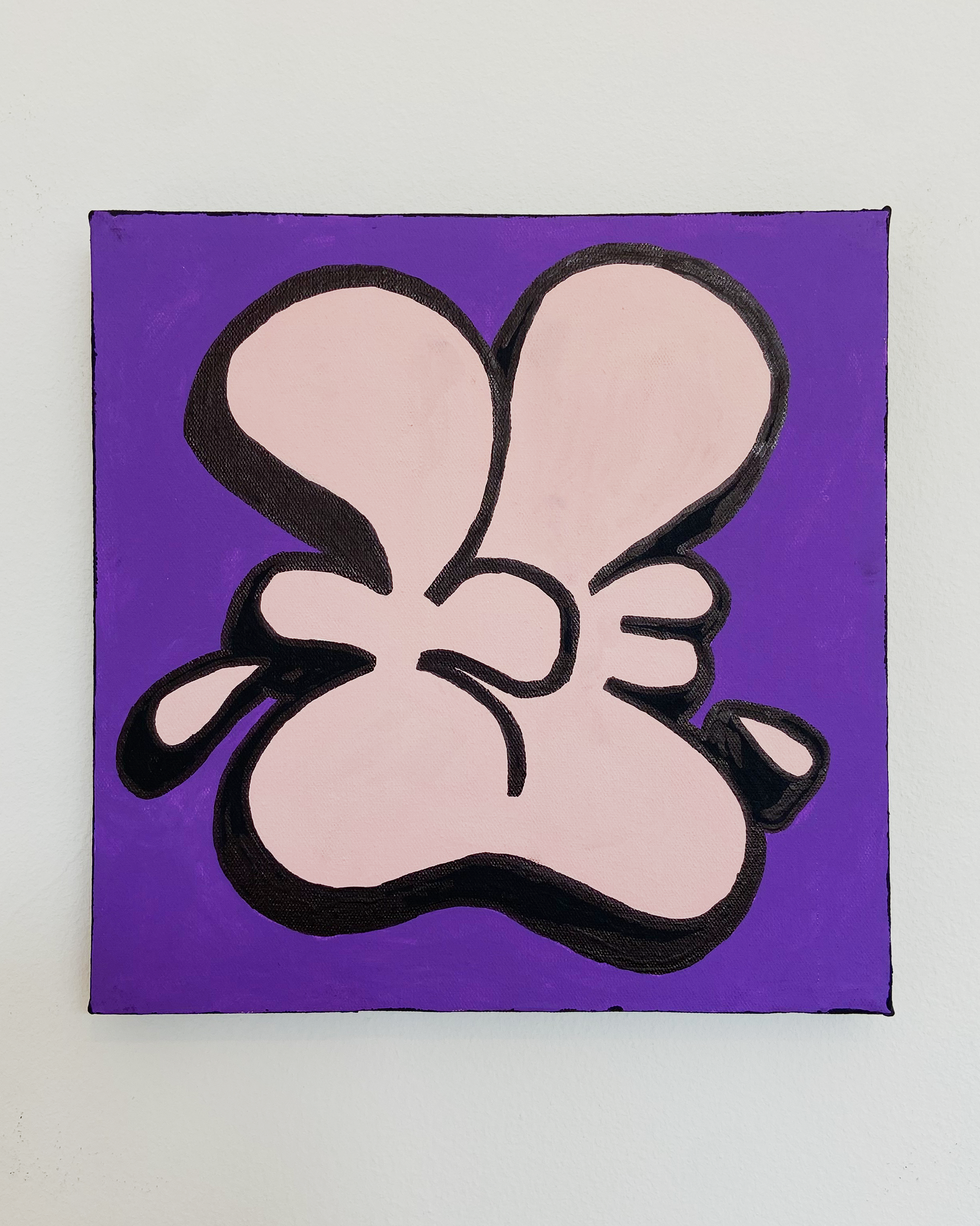 Front view of a 20 x 20 cm Nice Studio painting, with a pale pink stylized hand outlined in black against a purple background, hanging on a white wall.