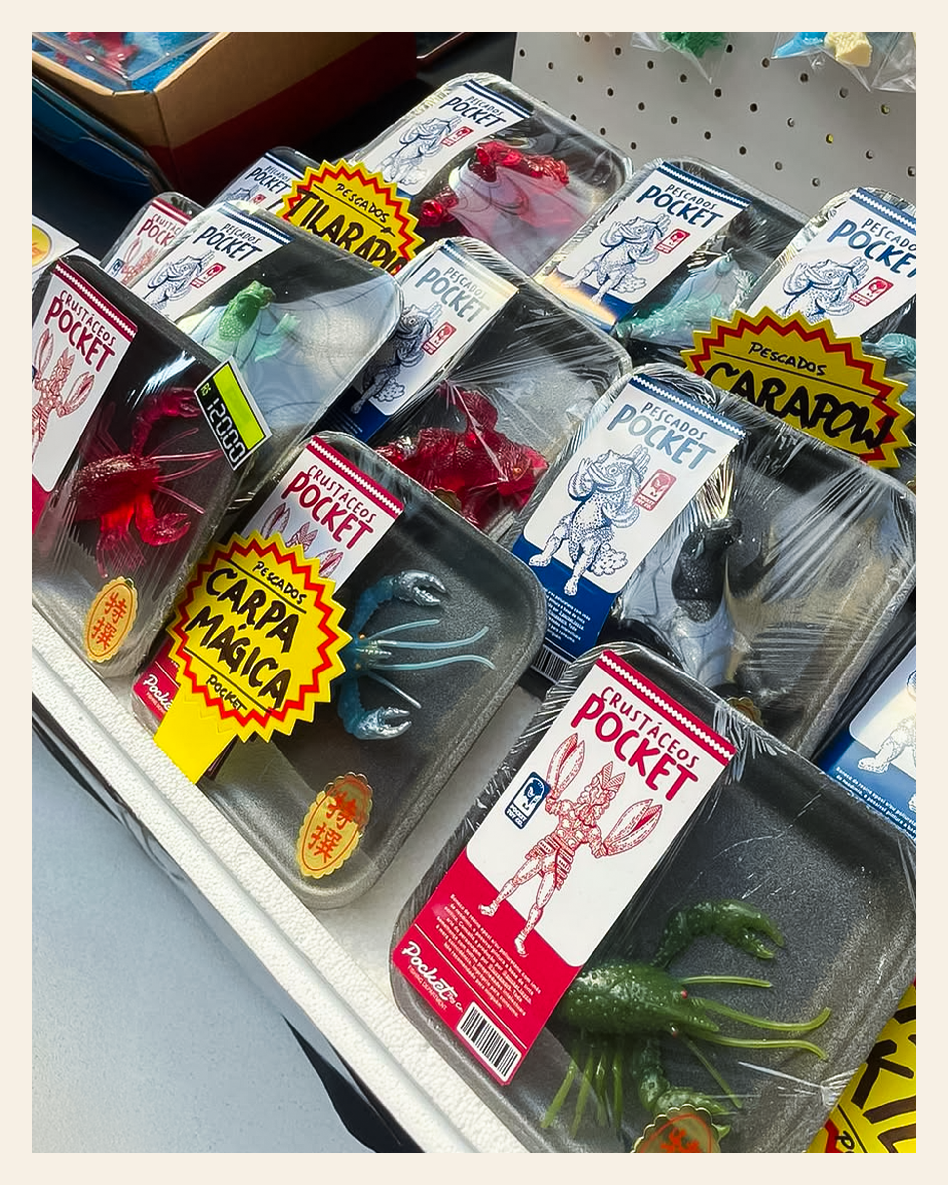 Pocket Toy Company figures displayed in trays with illustrated labels and colorful price signs.